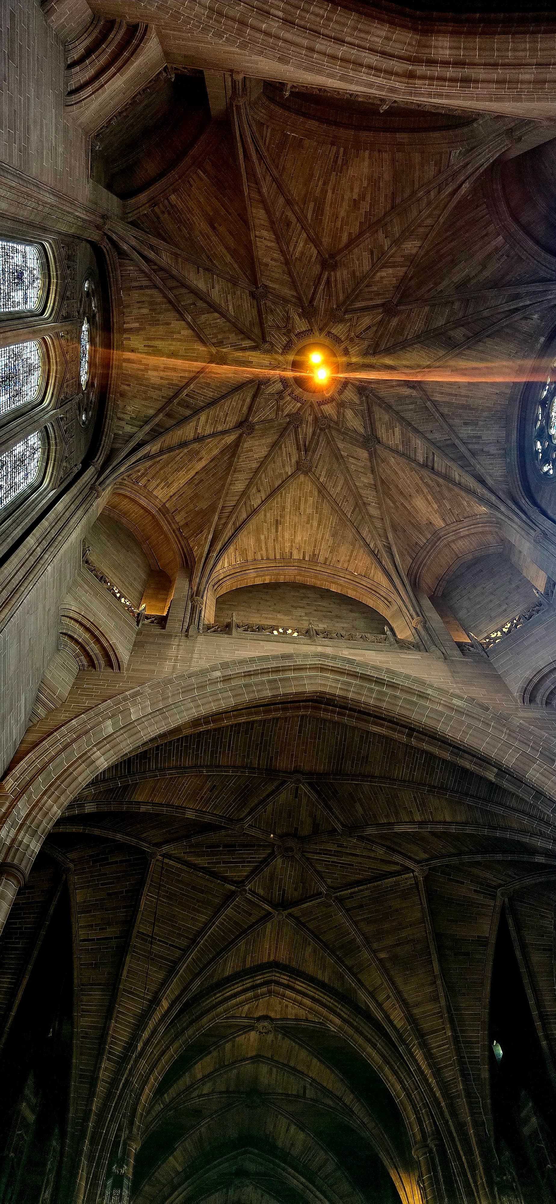 Intricate vaulted ceiling of Liverpool Cathedral with soft light glow